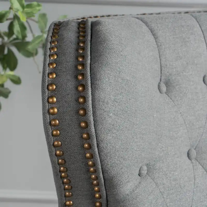 Fauteuil inclinable en tissu clouté par